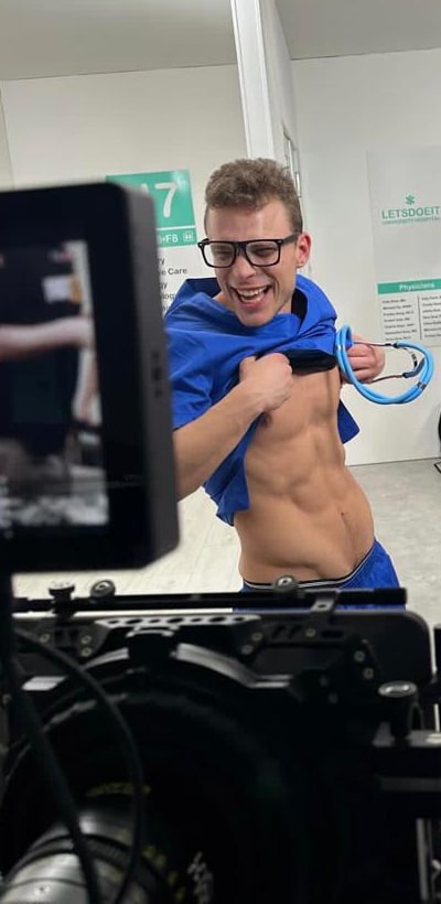Pavlos behind the camera on a medical-themed set